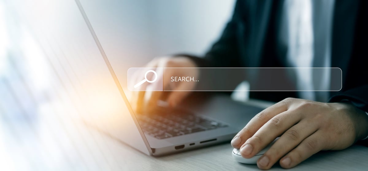 Person clicking internet search page on touch screen