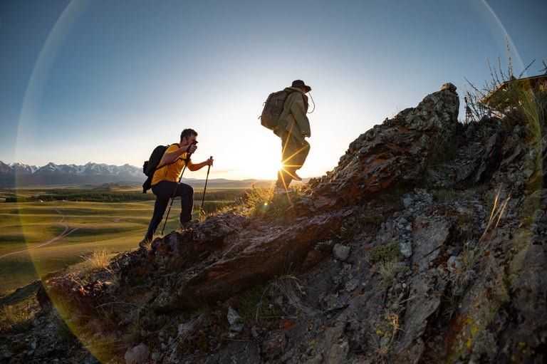 Hikers on Welsh mountain at sunset